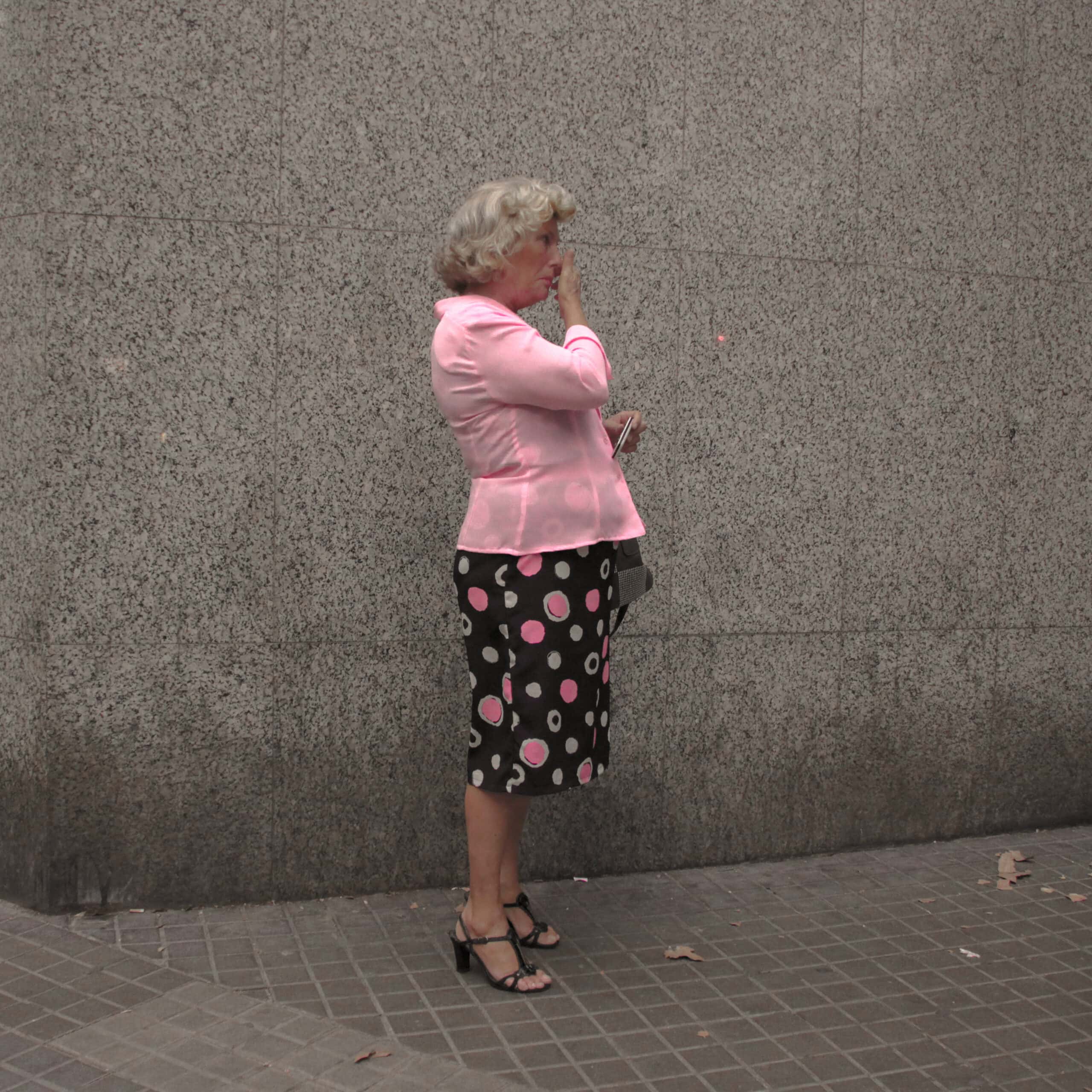 A woman in front of El Corte Inglés at Plaça Catalunya, 2016